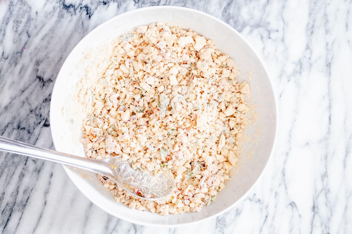 chickpea flour waffle batter being mixed in a white bowl