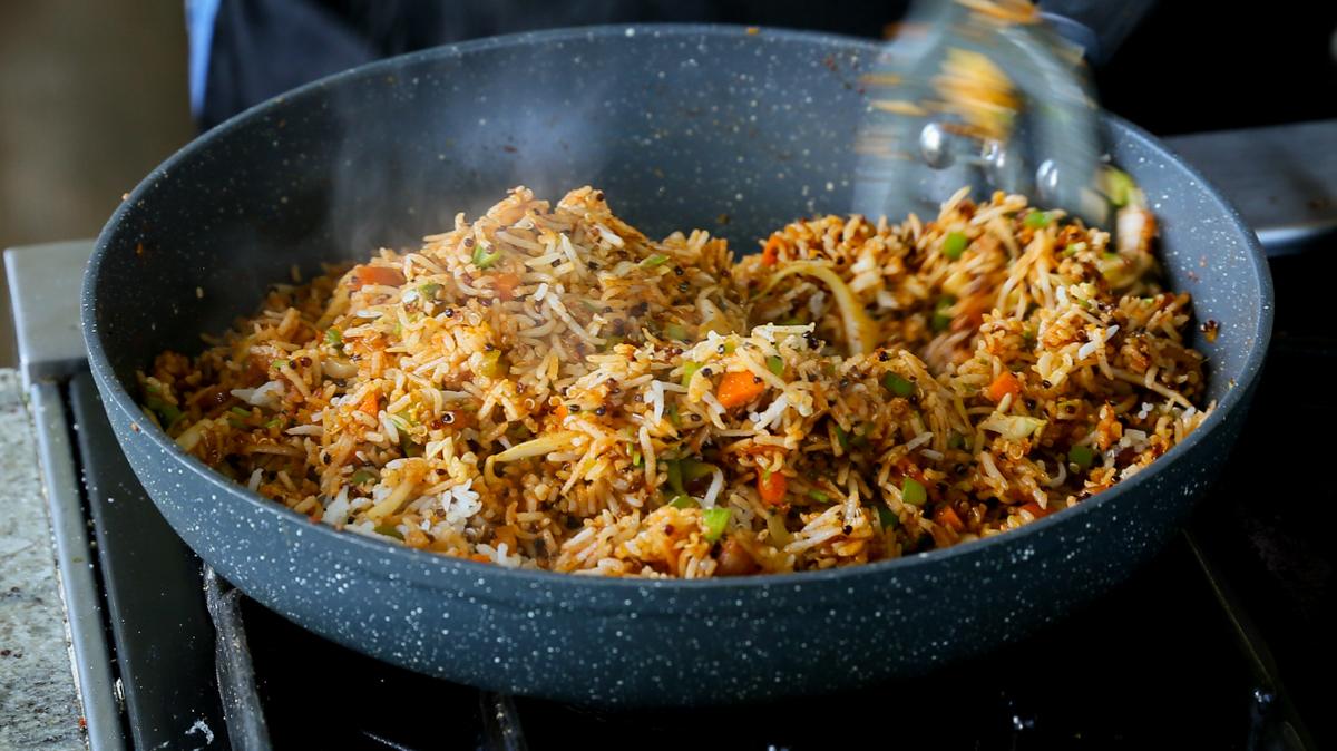 Schezwan fried rice in the pan, after mixing