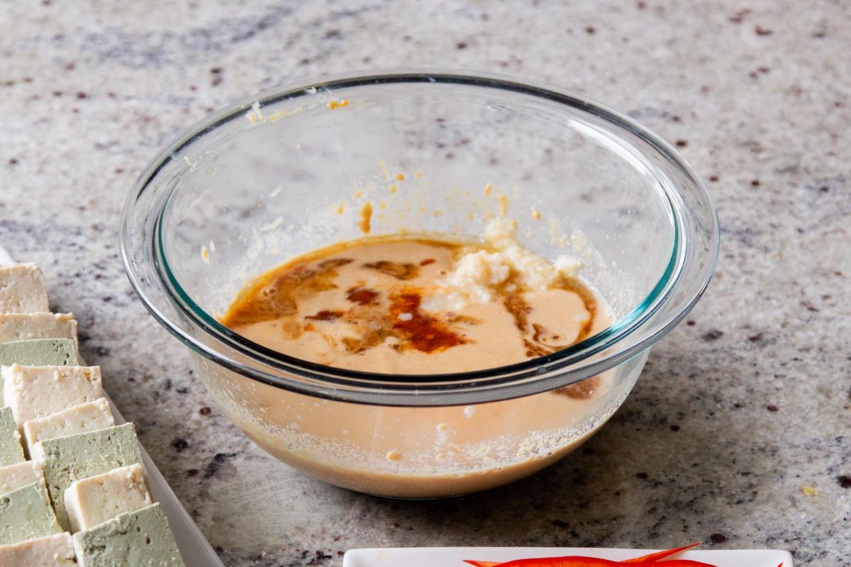 peanut sauce ingredients in a small glass bowl