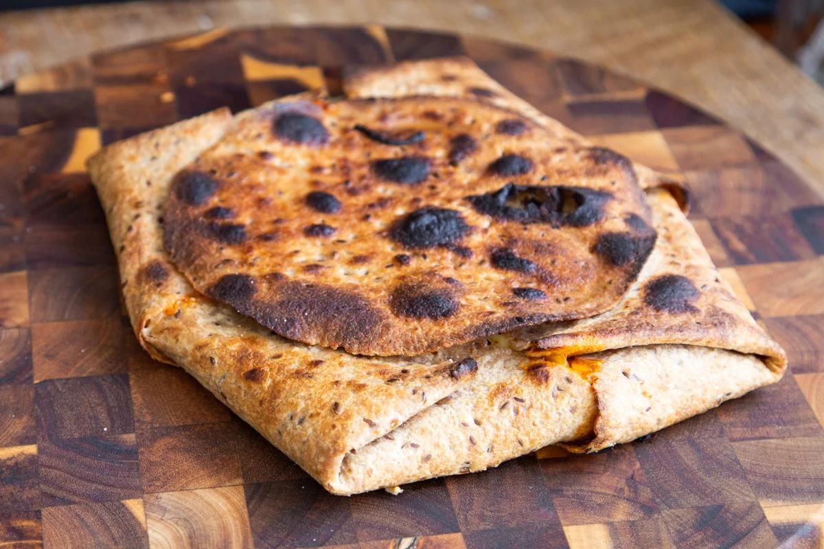 baked vegan pizza quesadilla before slicing