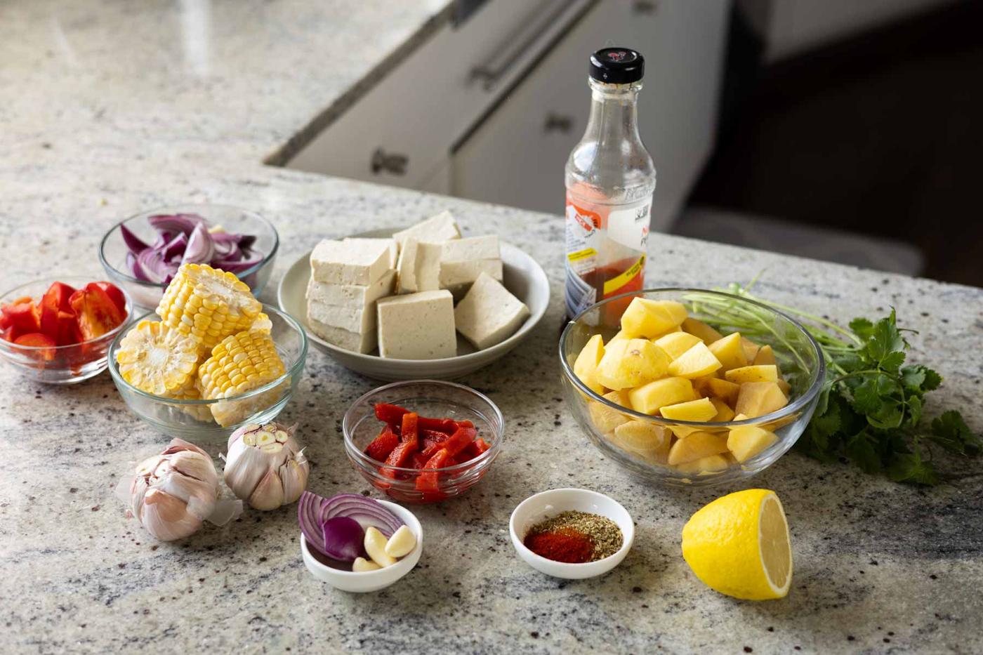 sheet pan peri-peri dinner ingredients on the kitchen counter