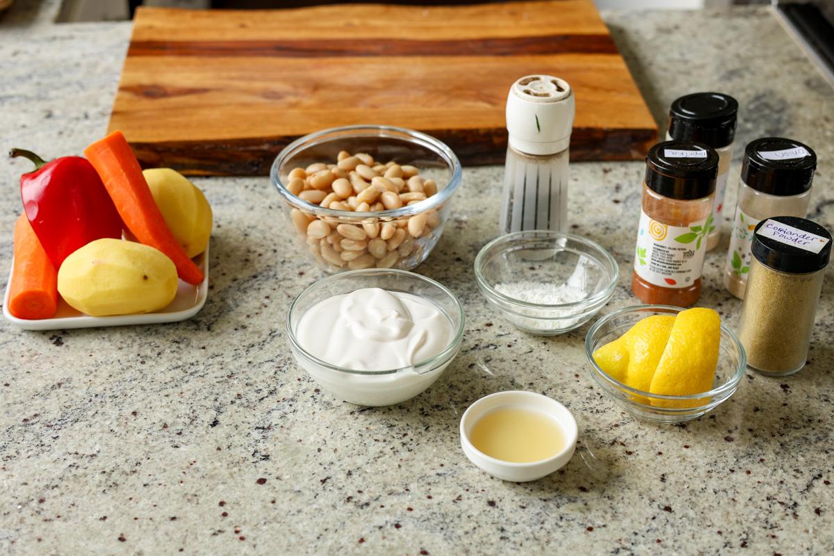 ingredients for sheet pan veggies and beans on the kitchen counter
