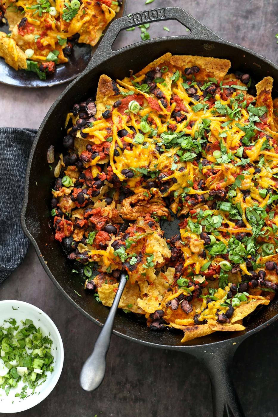 vegan skillet enchiladas with a spoon