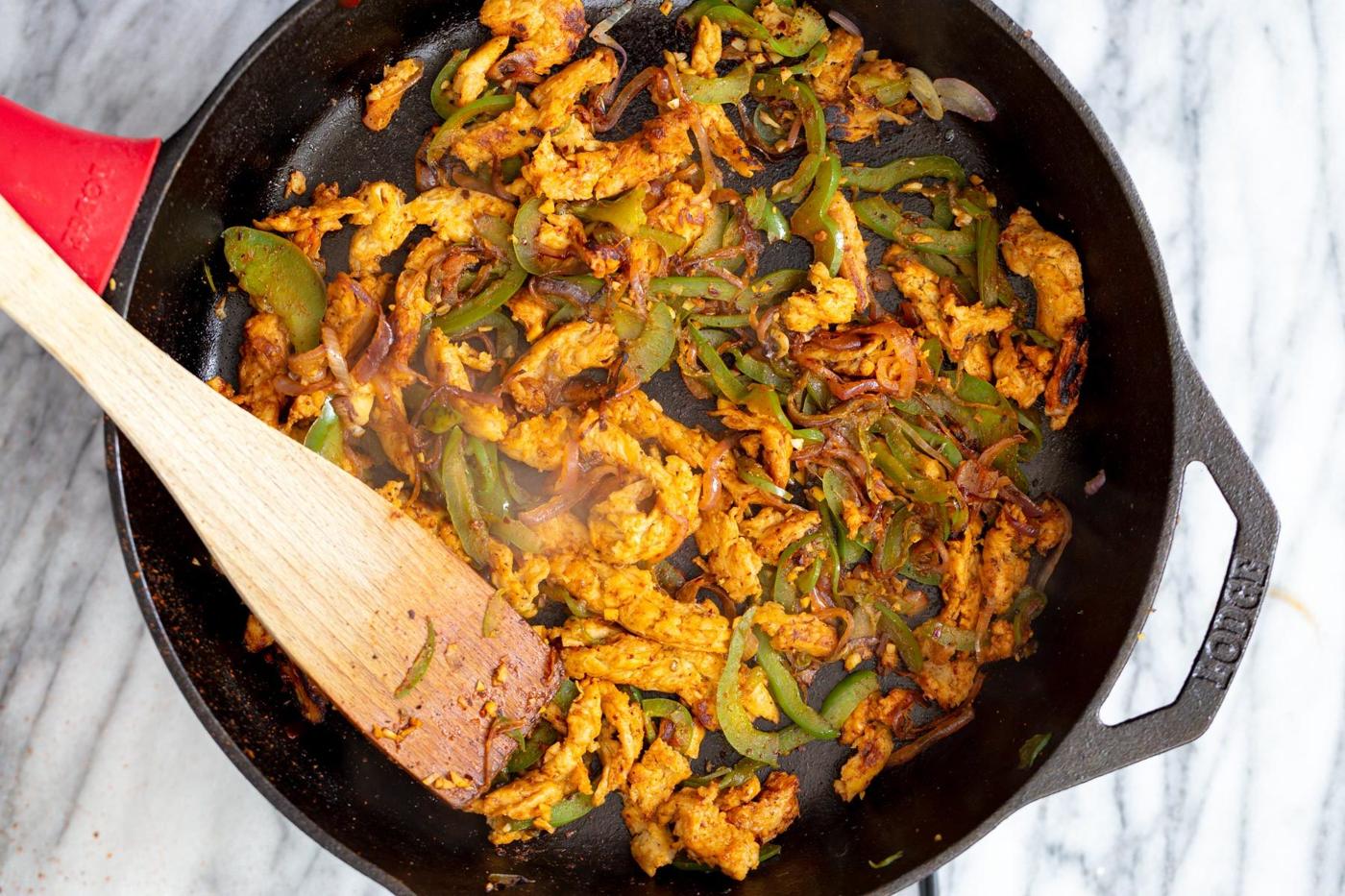 filling for vegan skillet enchiladas in a black cast iron skillet