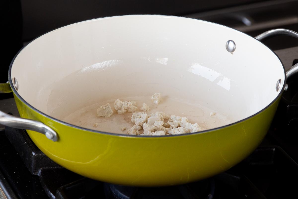 crumbled tofu in a green pan