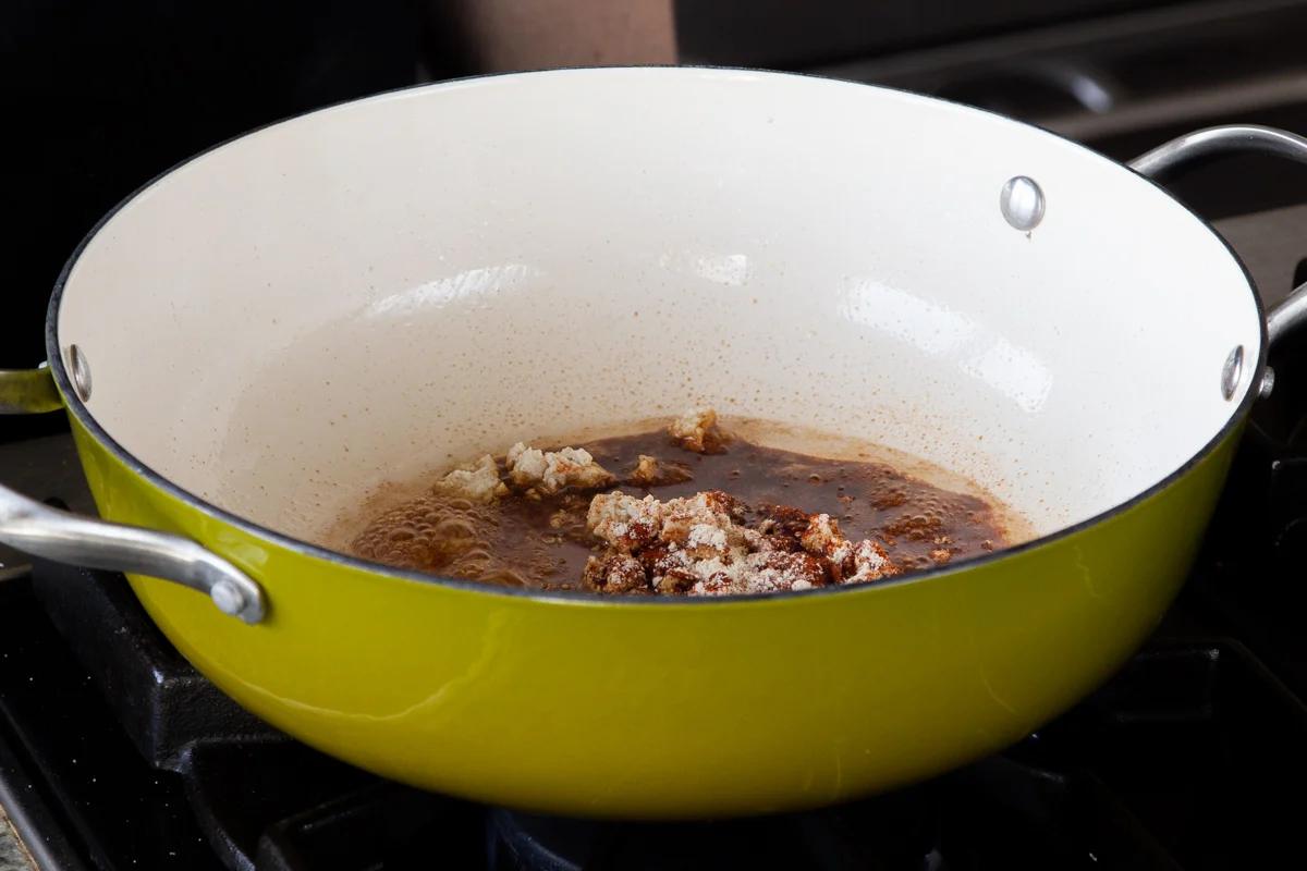 pan of tofu with seasoning added, before cooking