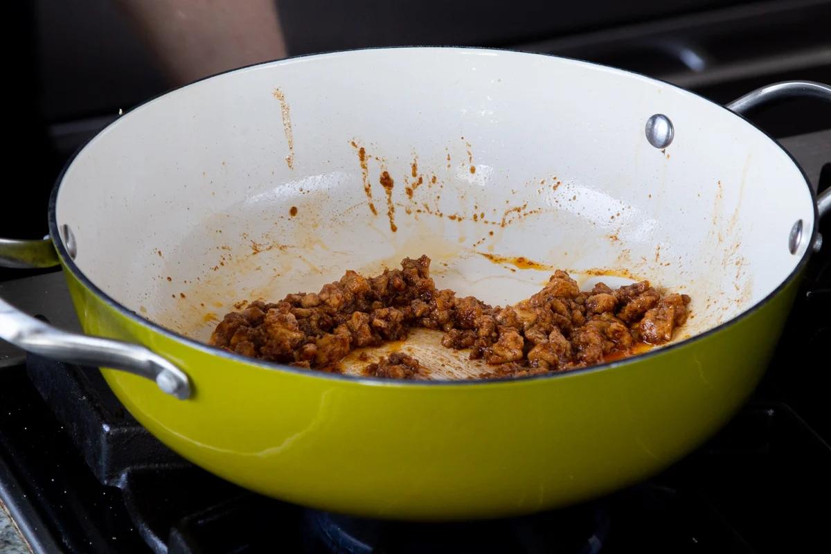 pan of tofu with seasoning added, after cooking