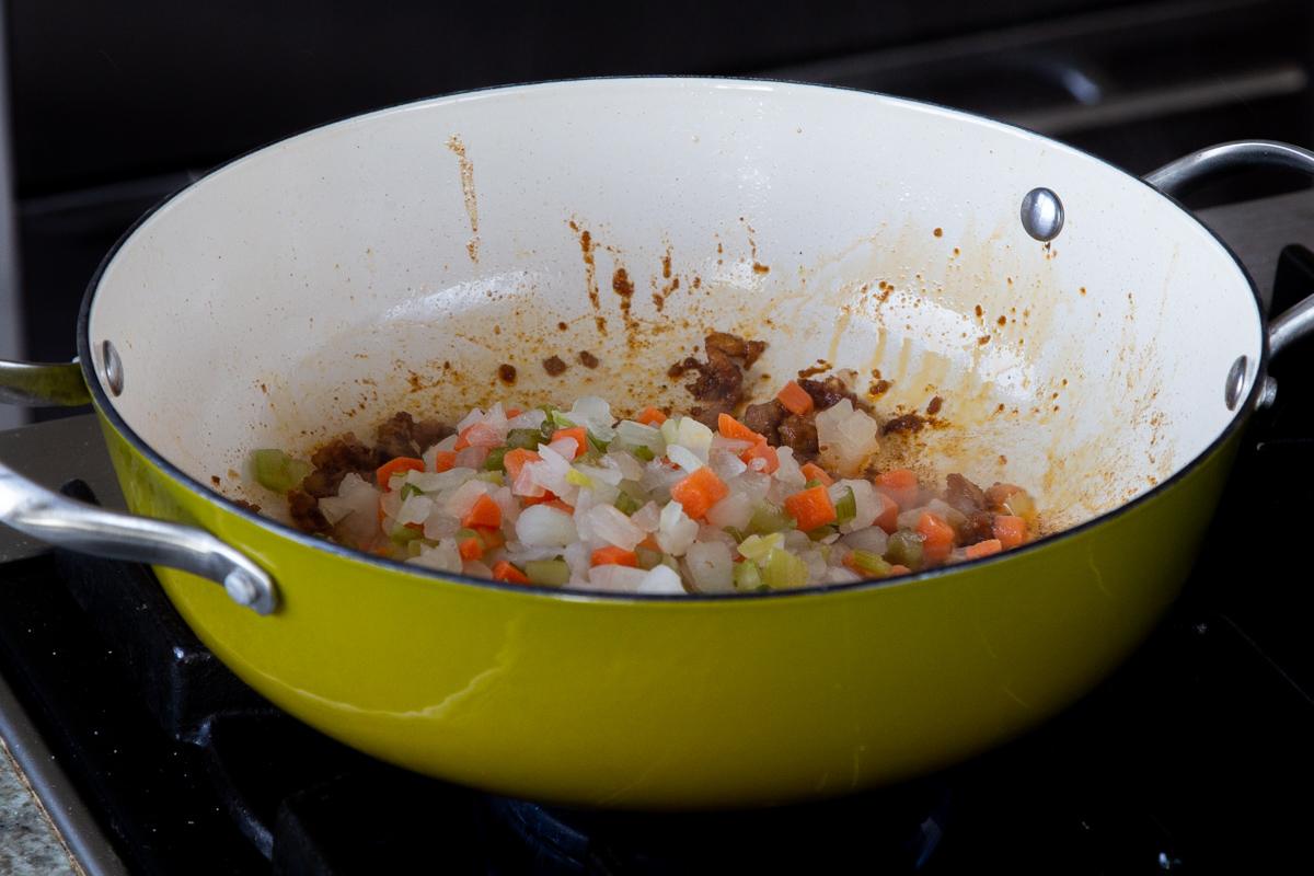 adding the veggies to the pan