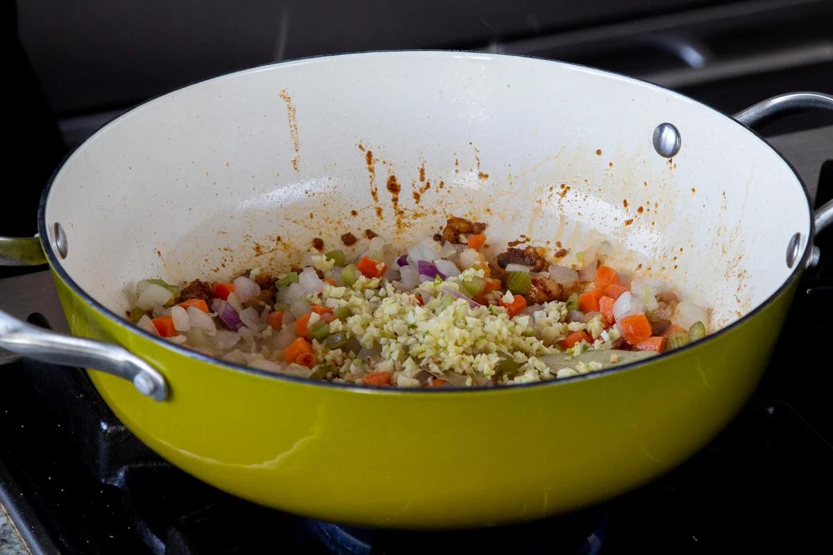 garlic and spices added to the pan, before cooking