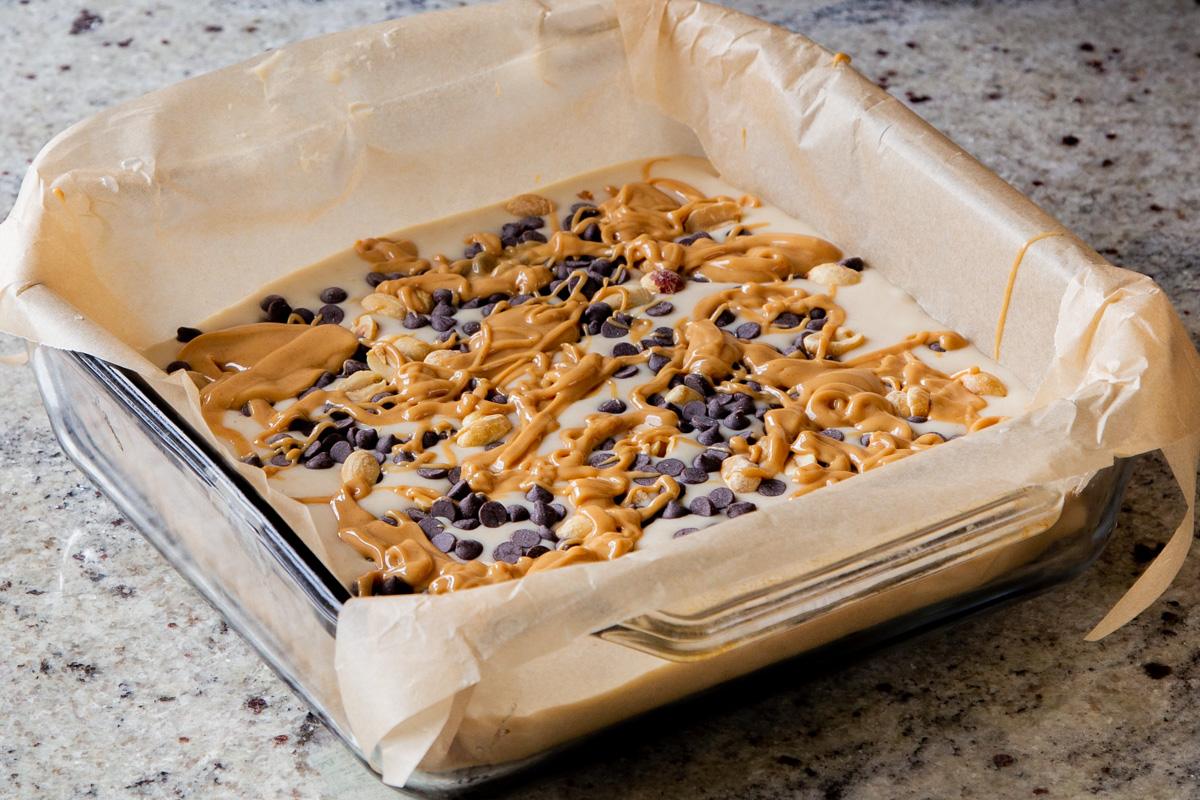 adding the melted peanut butter to the cake
