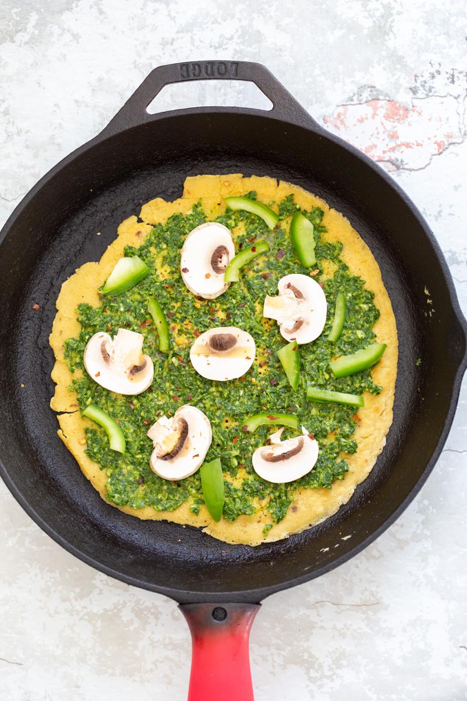 Socca Pizza on cast iron skillet