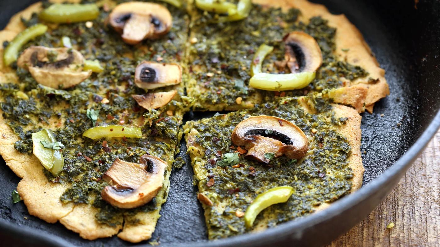 Vegan Socca Pizza with pesto and mushrooms