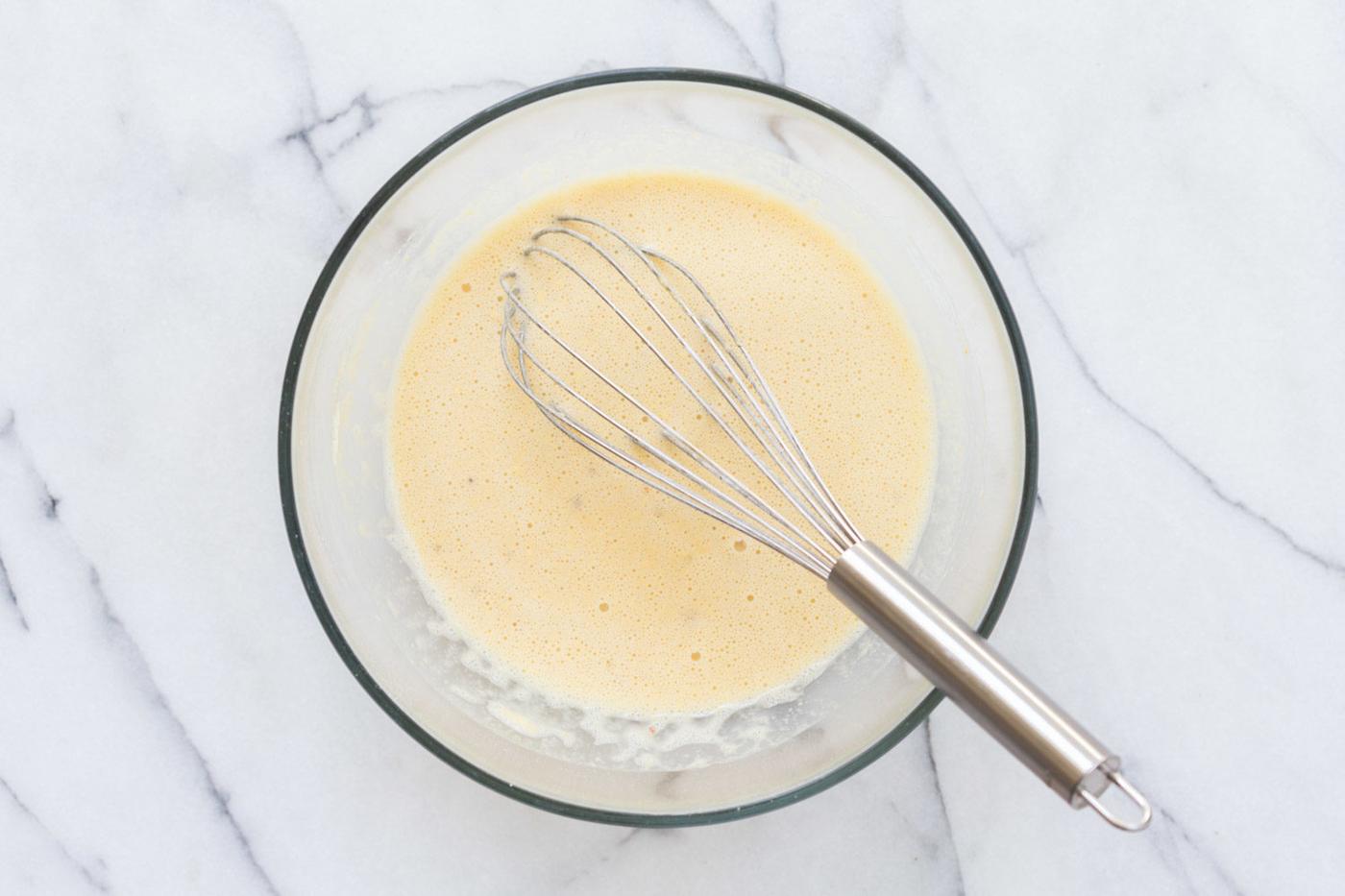 Chickpea Flour Batter in a glass bowl for our Vegan Socca