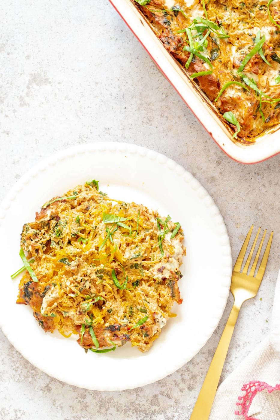 a plate with vegan spaghetti squash bake with creamy tomato sauce