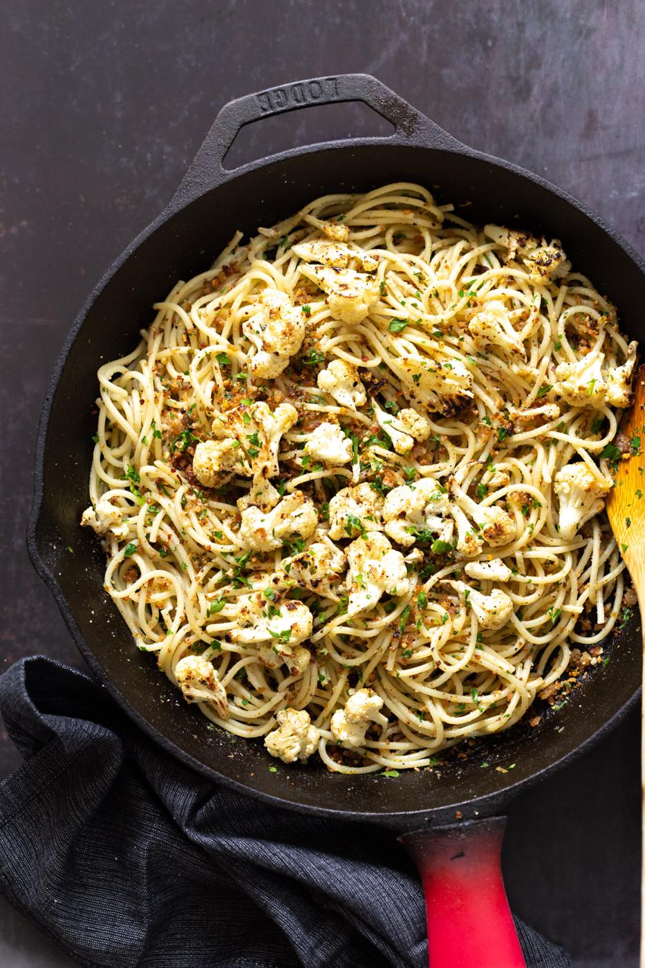 Spaghetti with toasted garlic breadcrumbs in a cast iron skillet