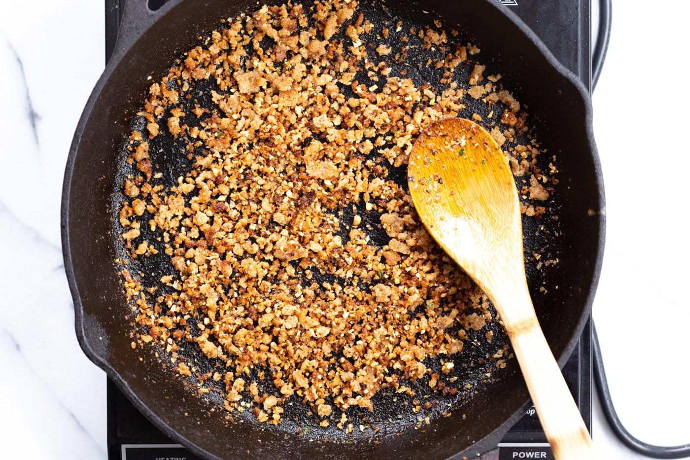 Toasted garlic breadcrumbs in cast iron skillet for our Spaghetti with toasted garlic breadcrumbs