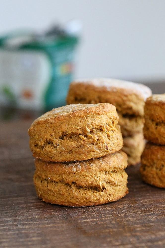side view of stacked healthy vegan sweet potato biscuits on a wooden board