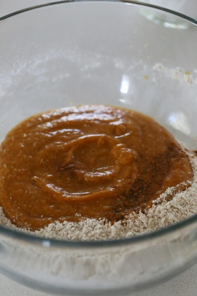 sweet potato puree being mixed with dry ingredients to make vegan sweet potato biscuits