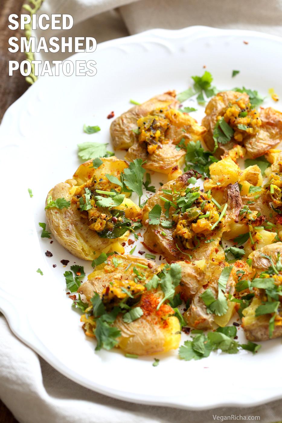 Indian Spiced Smashed Potatoes with Mustard Ginger Tempering. Bonda like Samosa is a spiced potato snack. These smashed potatoes are topped with Bonda style tempering of ginger, chile, turmeric and mustard seeds. Love Indian Snacks Like Samosa or Bonda? Then you will love these. All the flavor, half the work! #Vegan #Glutenfree #veganricha #nutfree #soyfree #Recipe | VeganRicha.com