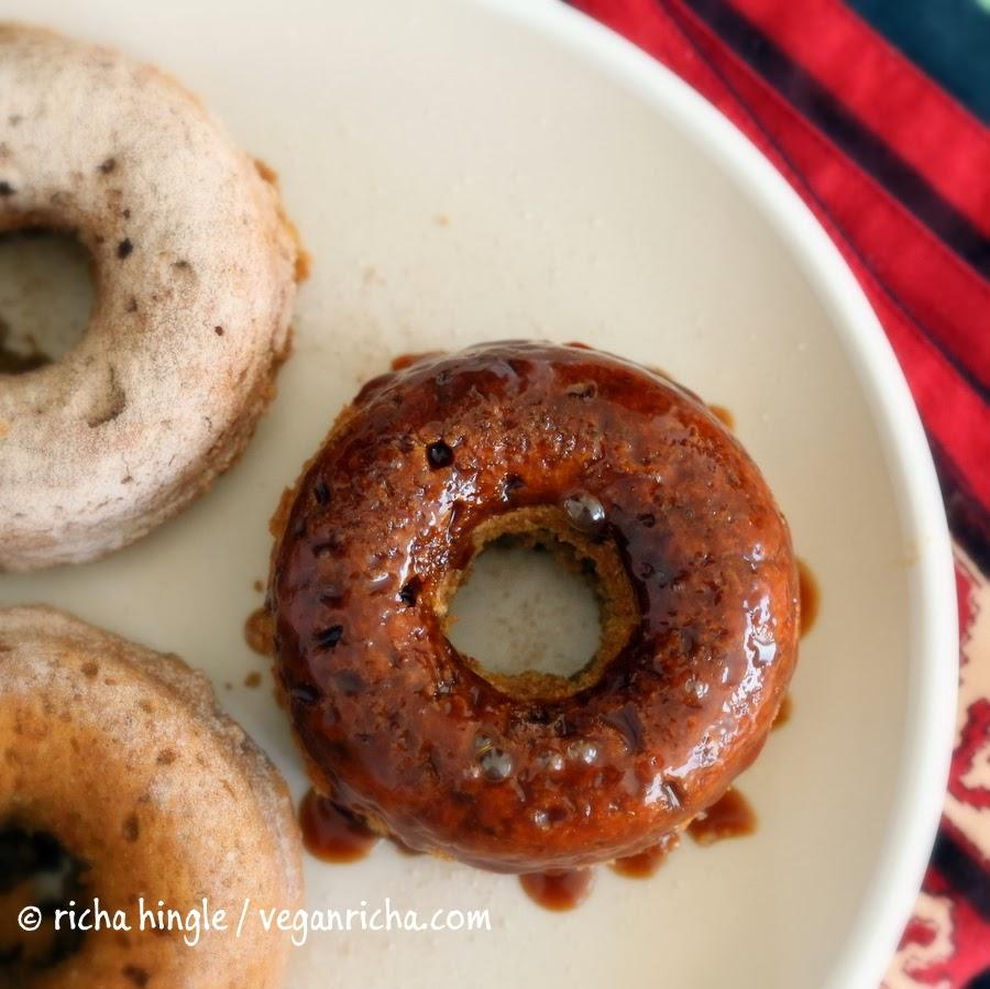 overhead shot of Baked Vegan Sweet Potato donuts glazed with salted caramel on a white plate