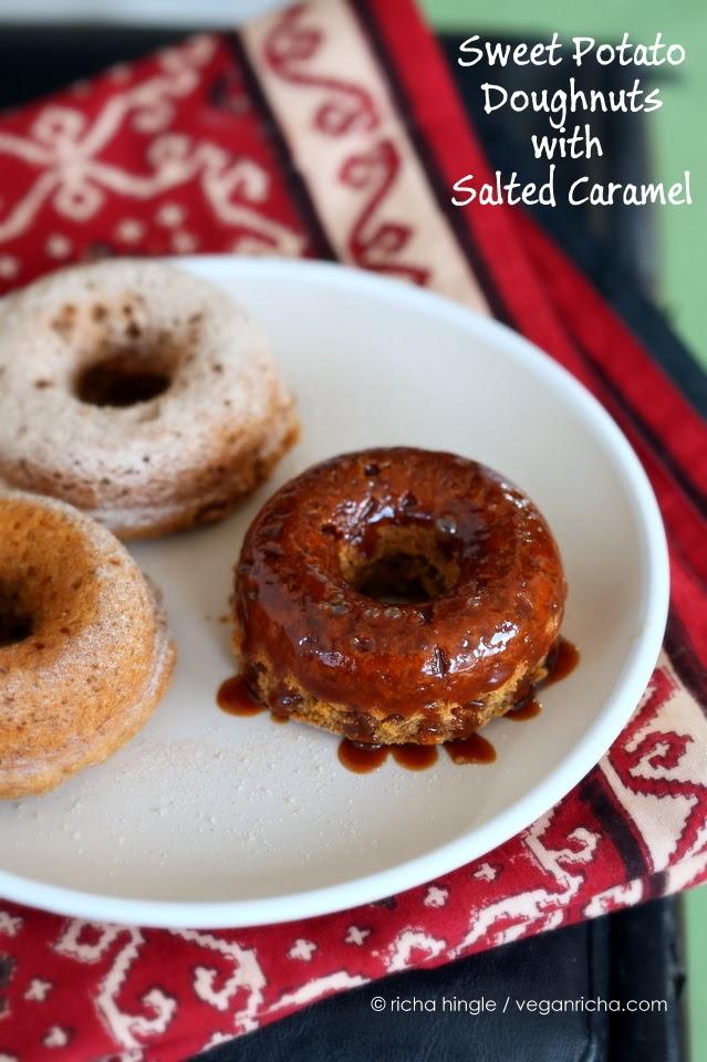 three vegan baked sweet potato donuts on a white plate
