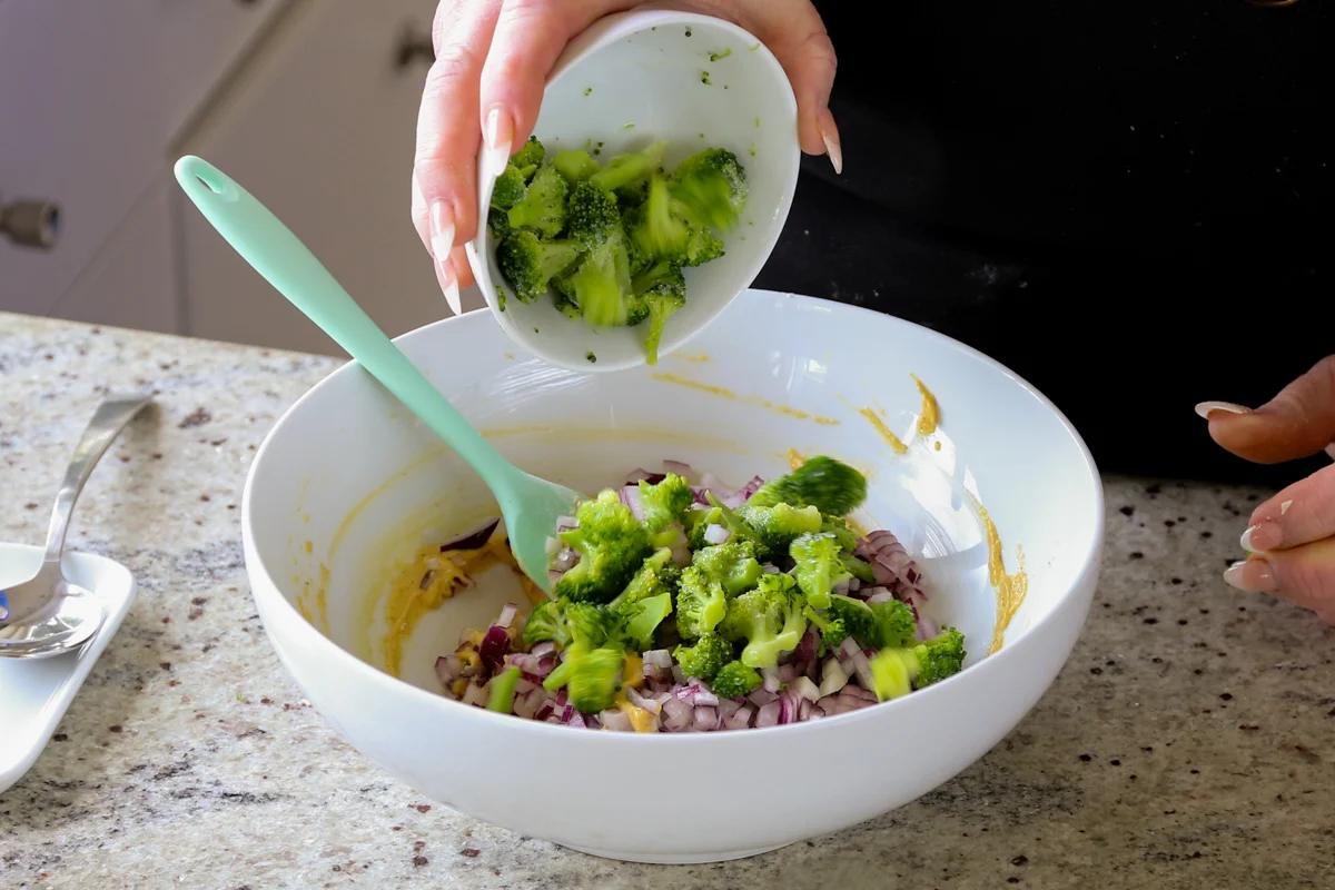 adding broccoli to the pakora batter