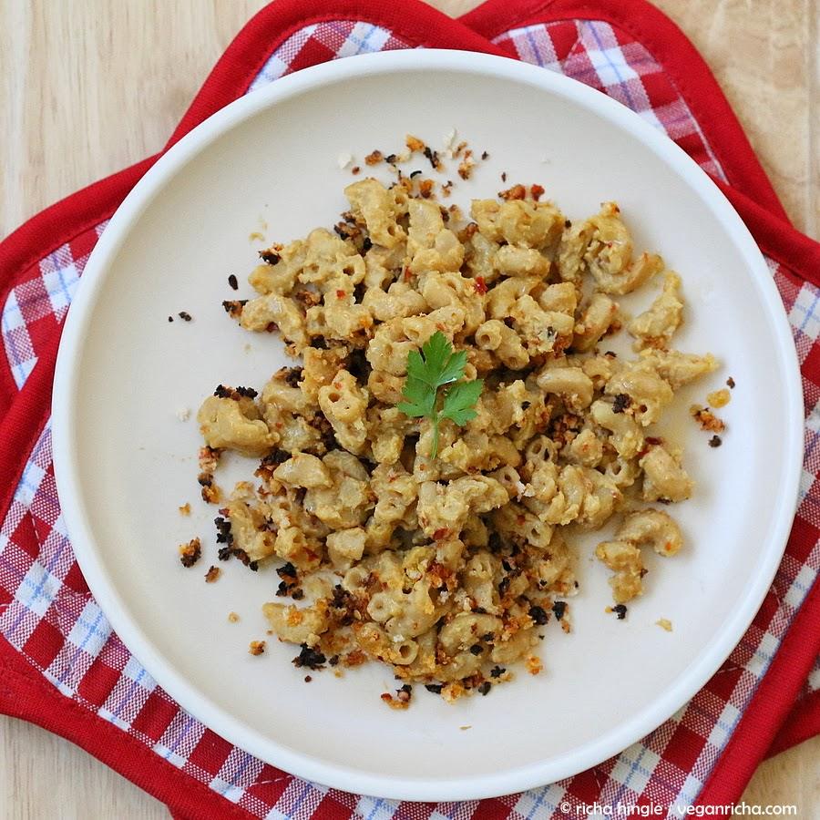 overhead shot of a serving of vegan Cajun mac and cheese topped with toasted breadcrumbs