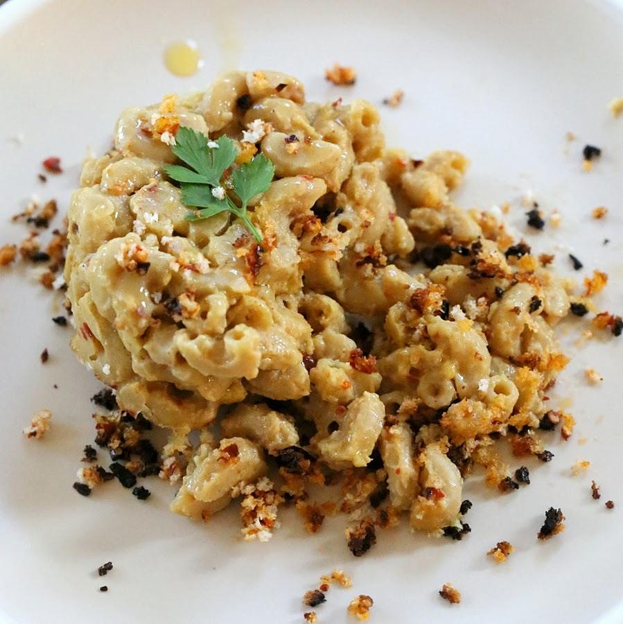 close-up of a serving of dairy-free spicy Cajun mac and cheese served with toasted breadcrumb topping