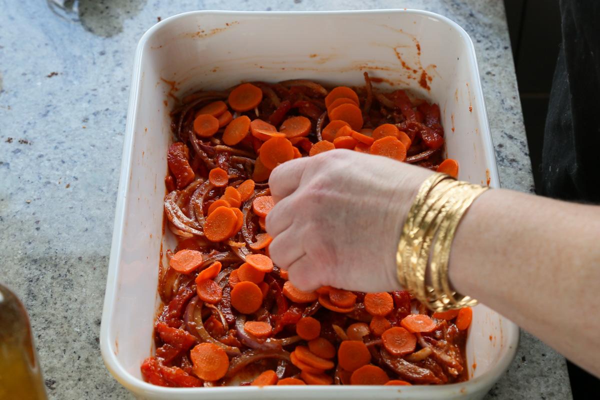adding the veggies to the pan