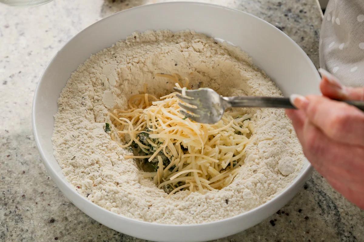 adding vegan cheese to the dry ingredients