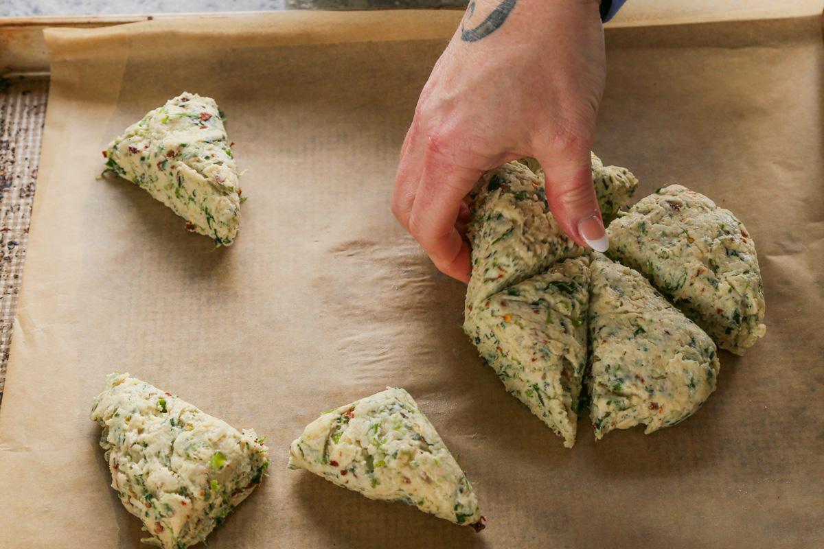 spinach and cheese scones cut into triangles, before baking