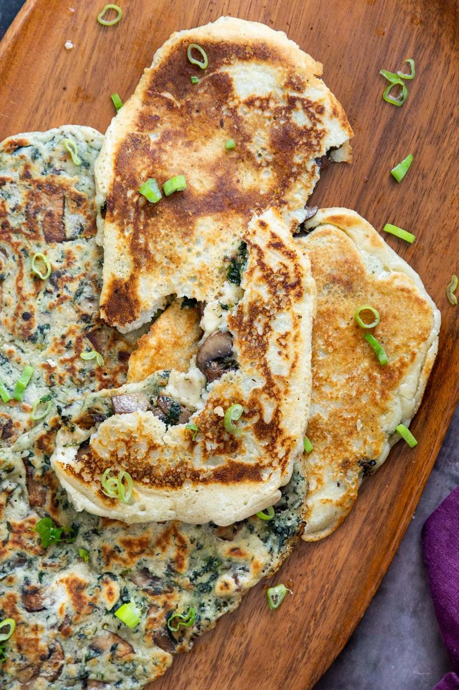vegan glutenfree spinach and mushroom stuffed naan bread sprinkled with sliced green onions