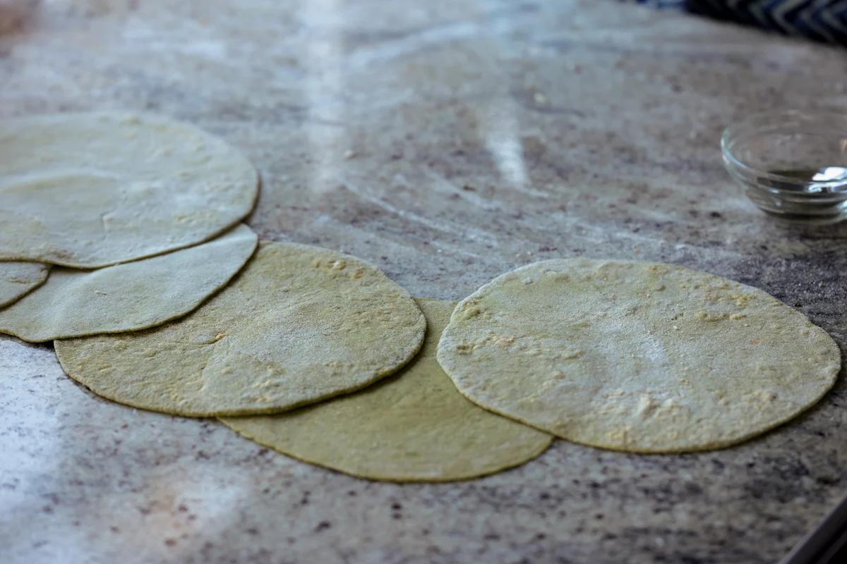 spinach paratha rolled out on the counter