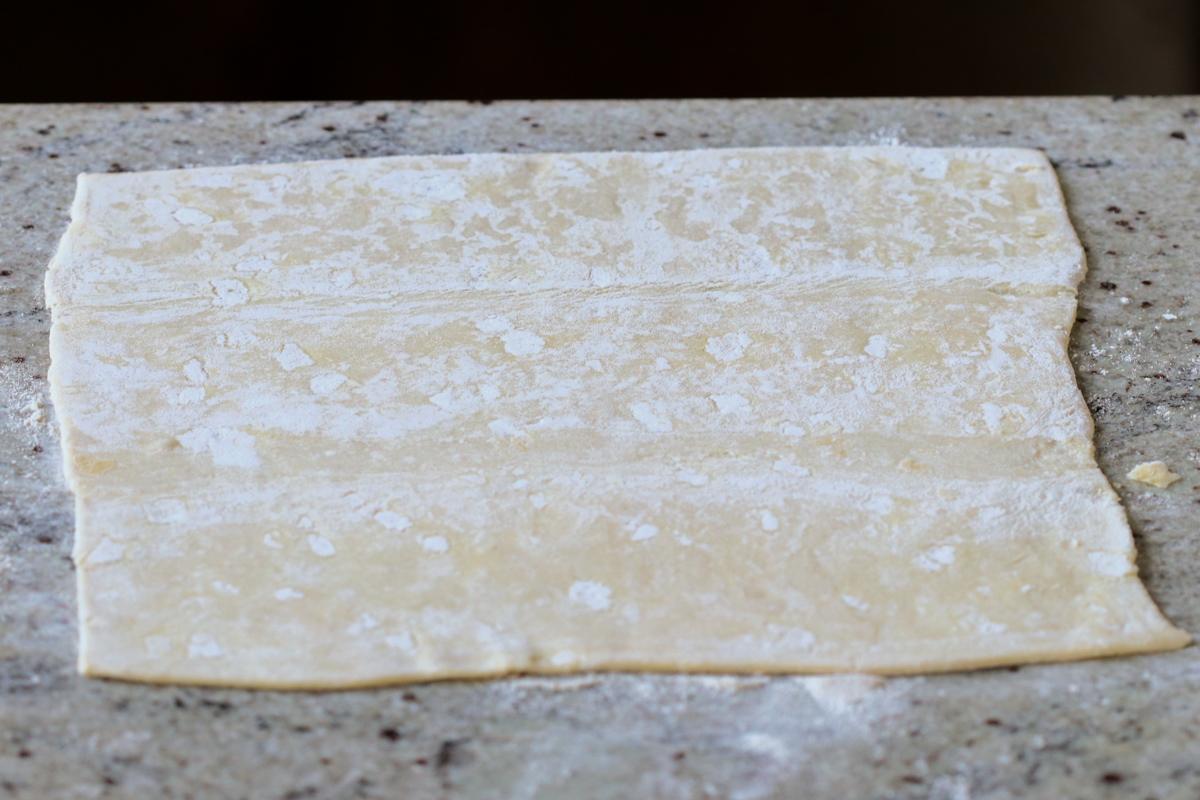 floured puff pastry on the countertop