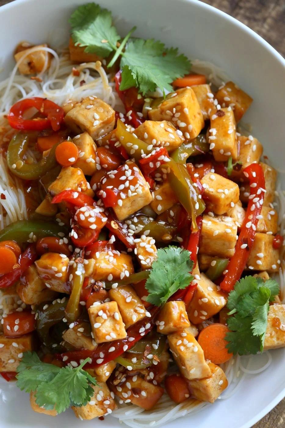 Sticky Ginger Sesame Tofu and Veggie stir fry with vermicelli or maifun noodles. Easy weekday Dinner. Vegan Gluten-free nut-free Recipe. Use chickpeas or more veggies to make Tofu-free | VeganRicha.com
