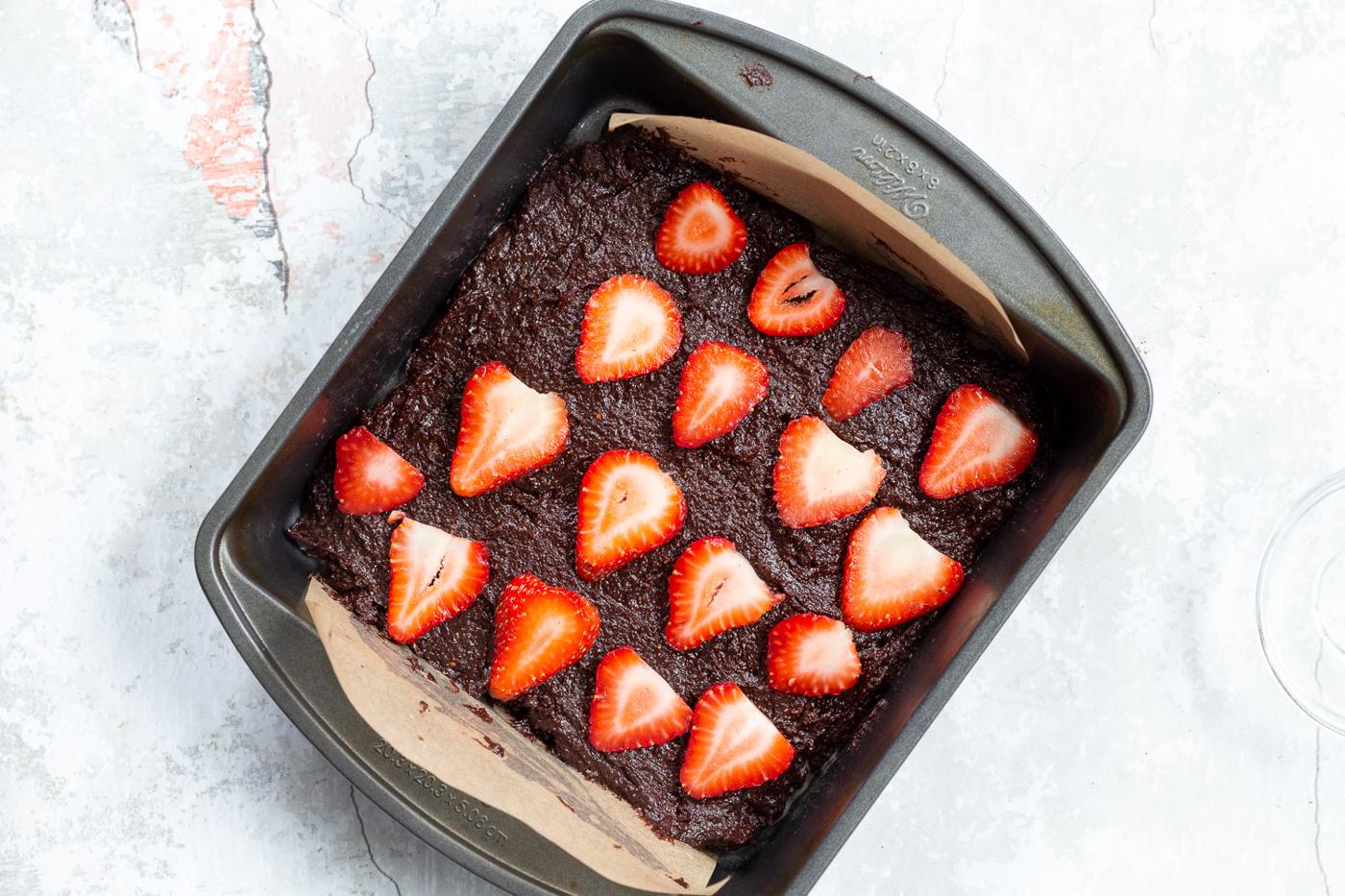 Batter for our Vegan Strawberry Brownies in a grey brownie pan