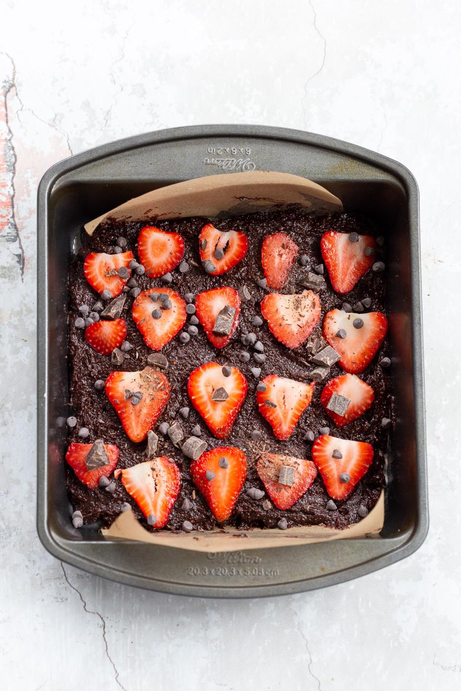Batter for our Vegan Strawberry Brownies in a grey brownie pan