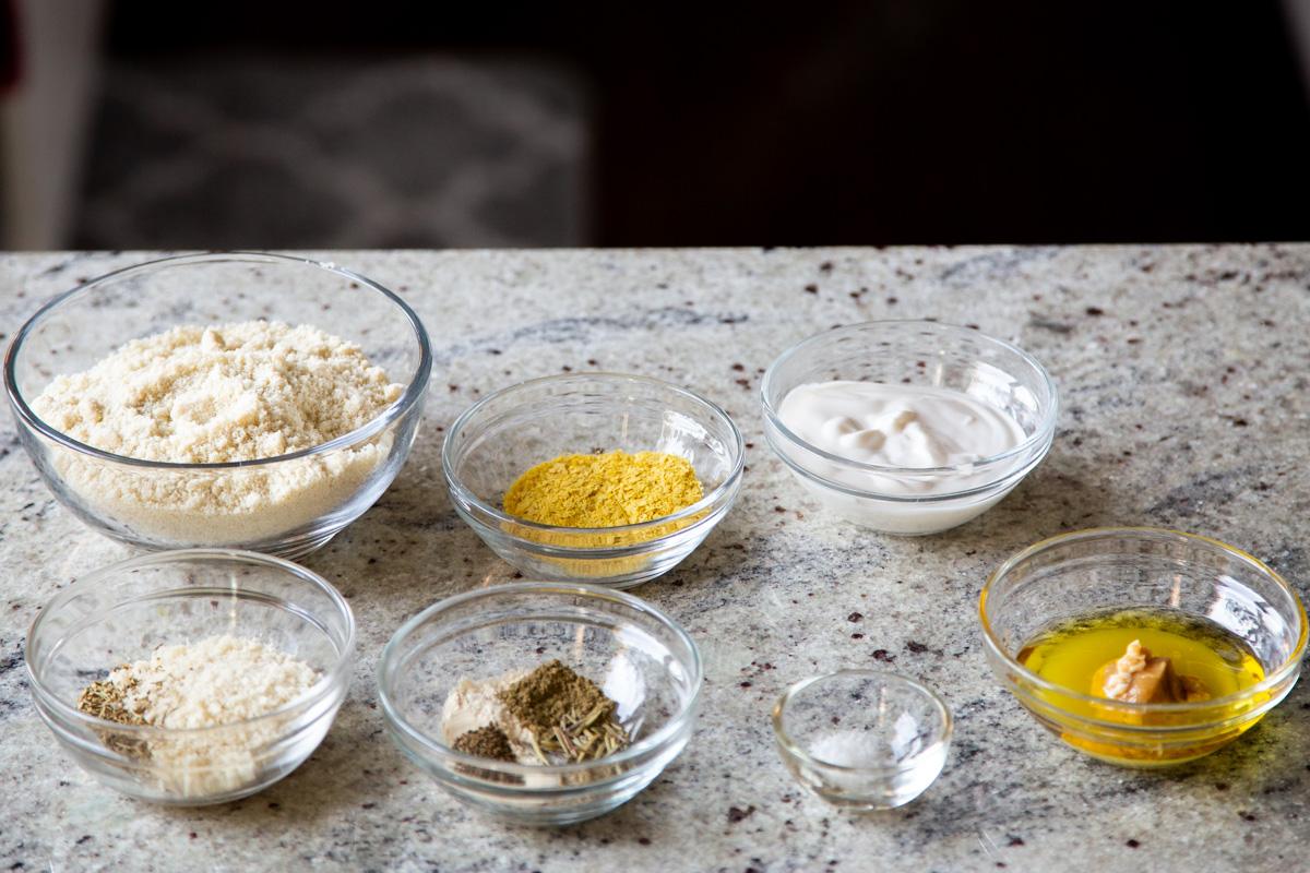 ingredients for making vegan cheese balls on a concrete countertop