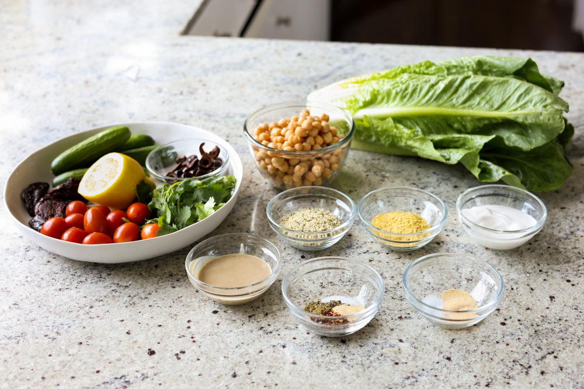 summer spinach salad ingredients on a kitchen counter