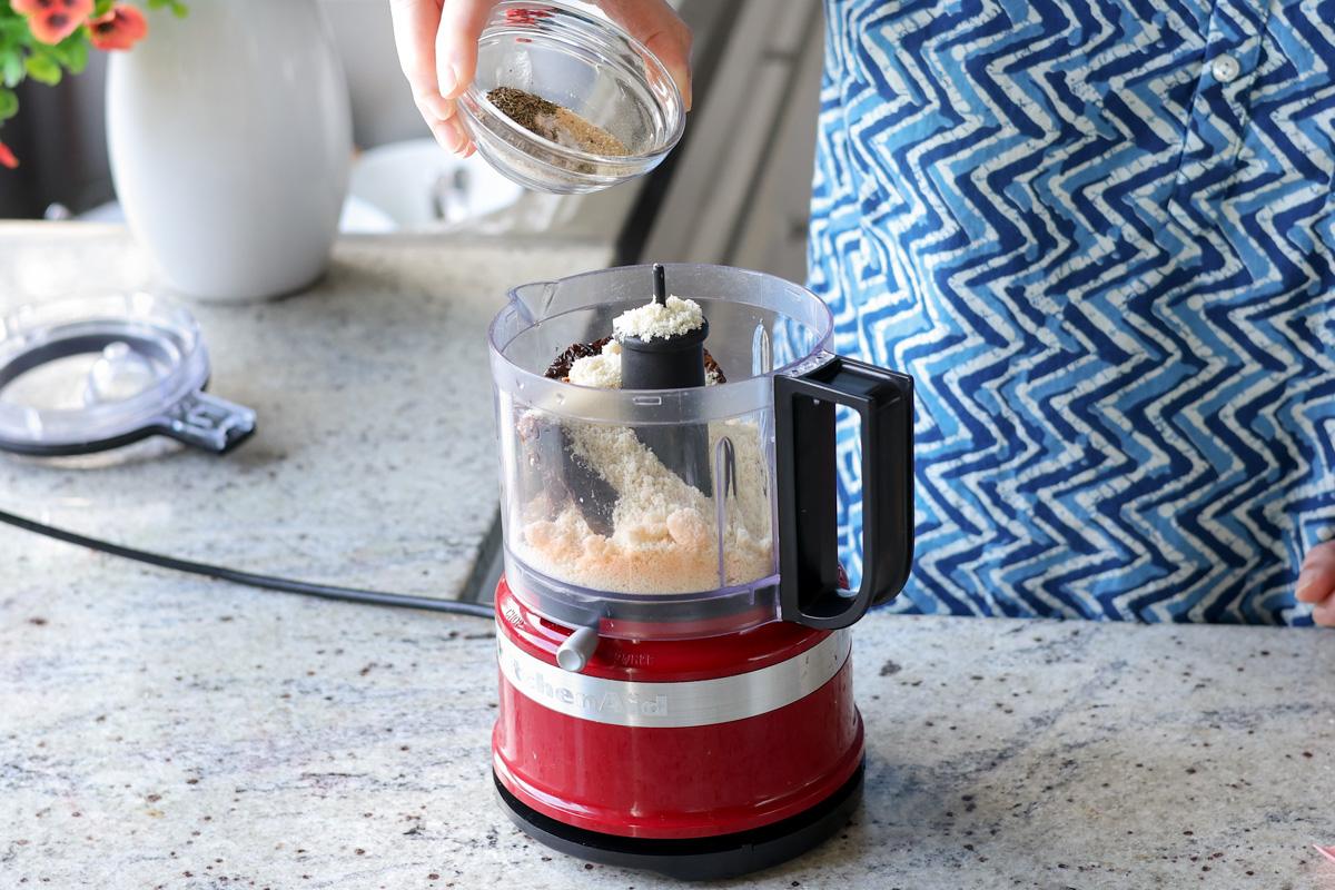 adding almond flour and spices to the food processor