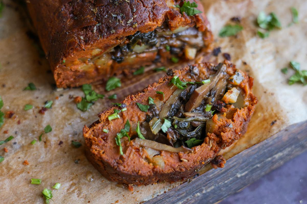 sliced sun dried tomato roast on a cutting board