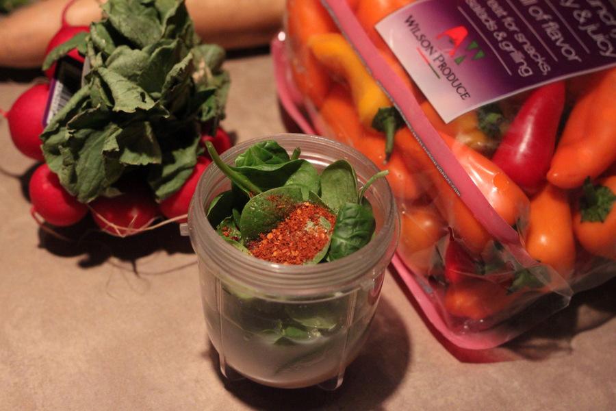 spinach and cayenne pepper in a magic bullet