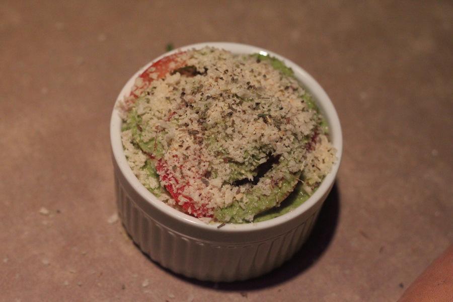 vegan alfredo bake being topped with breadcrumbs