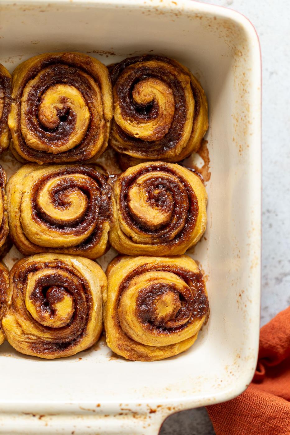 overhead shot of sweet potato no yeast cinnamon rolls in a casserole dish