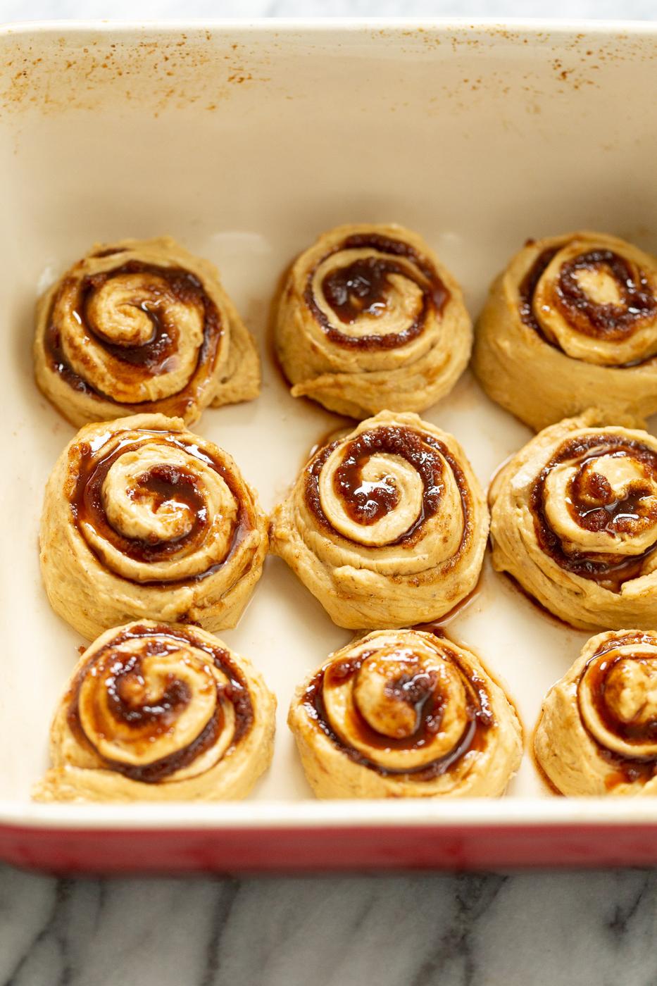 no yeast sweet potato cinnamon rolls in casserole dish ready to be baked