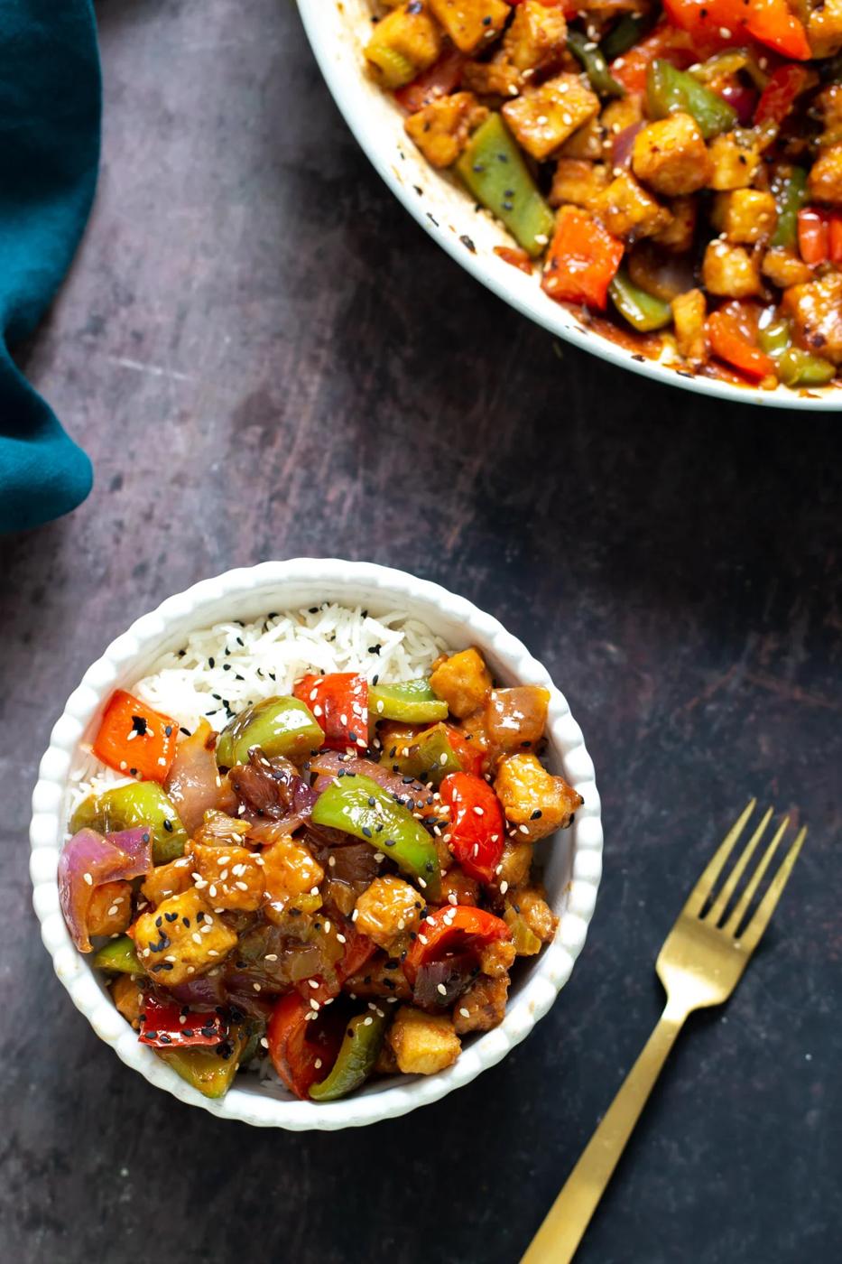 overhead shot of a bowl with rice topped with sweet and sour tofu
