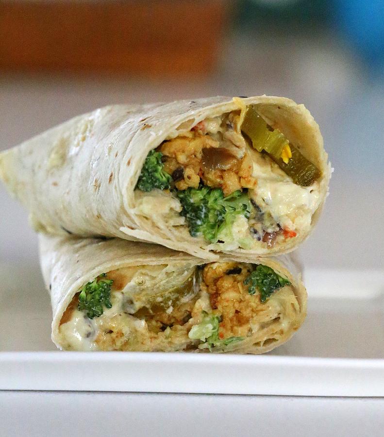 two stacked Tofu Wraps filled with Tempeh Scramble, Jalapeno Popper Dip and Broccoli