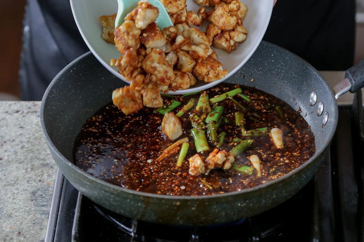 adding crispy tofu to the pan