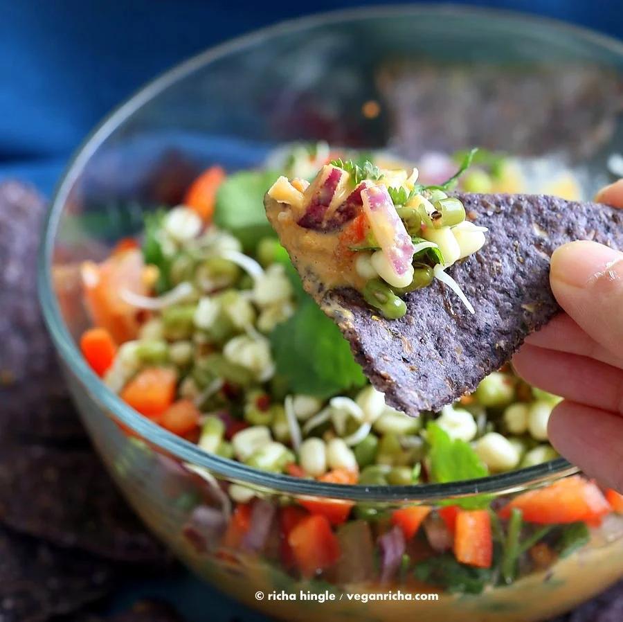 This Thai layered Dip has carrots, Peanut butter sauce, spicy salsa, cilantro, sprouts, & peanuts. all layered up for the perfect appetizer. #Vegan #Glutenfree #Recipe #VeganRicha | Pitzn