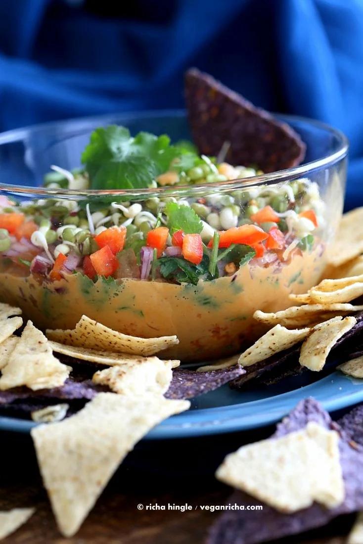 This Thai layered Dip has carrots, Peanut butter sauce, spicy salsa, cilantro, sprouts, & peanuts. all layered up for the perfect appetizer. #Vegan #Glutenfree #Recipe #VeganRicha | Pitzn